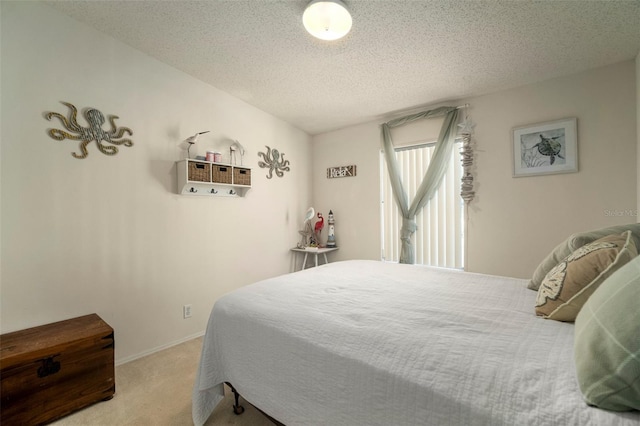 carpeted bedroom with a textured ceiling