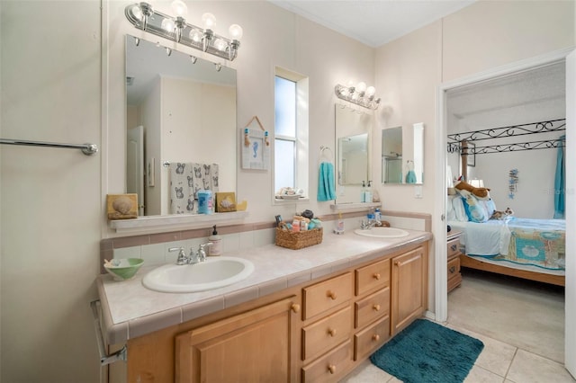 bathroom with tile patterned flooring and vanity