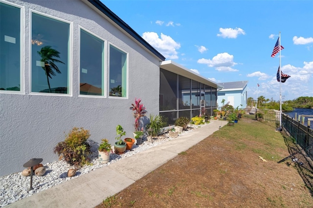 view of yard featuring a sunroom