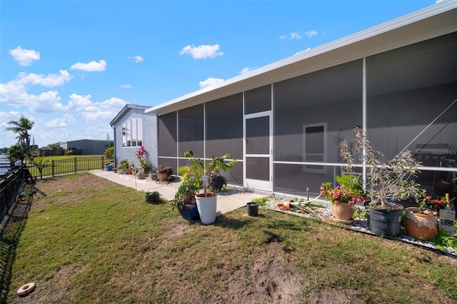 view of yard featuring a sunroom