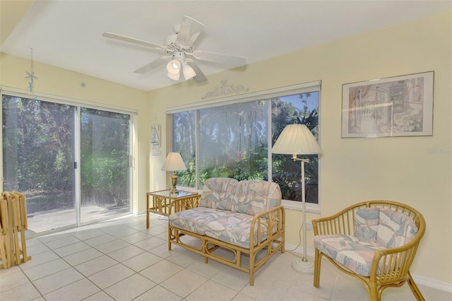 sitting room featuring radiator, ceiling fan, and light tile patterned floors