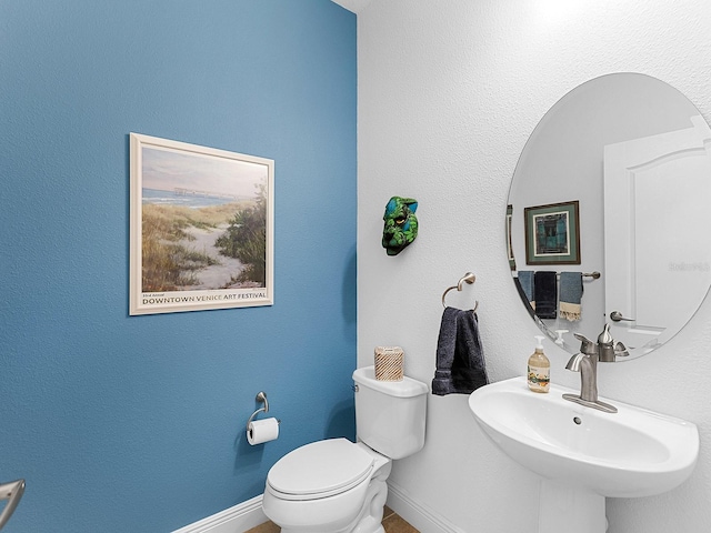 bathroom with sink and toilet