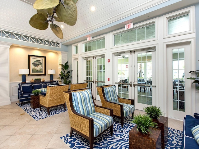 sunroom with french doors and ceiling fan