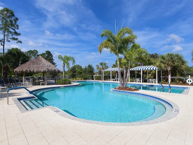 view of swimming pool featuring a gazebo and a patio area