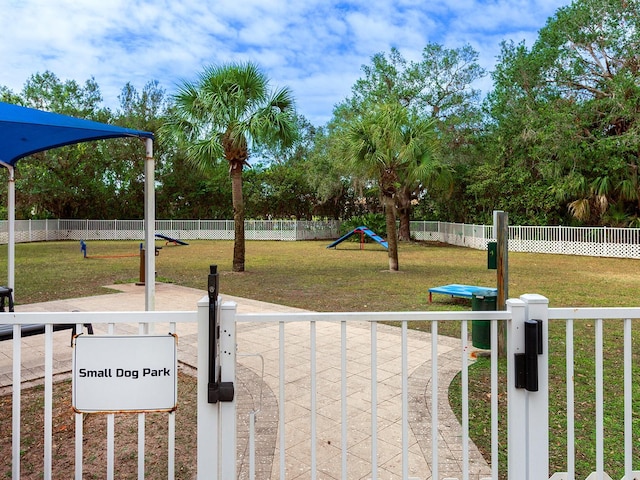 view of jungle gym with a lawn