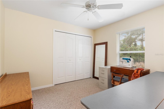 home office featuring light colored carpet and ceiling fan