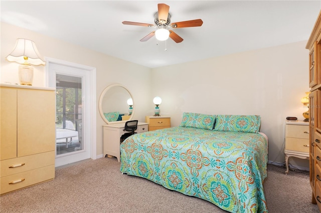 bedroom with ceiling fan and light carpet