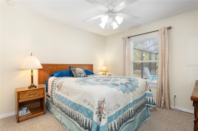 bedroom with ceiling fan and light colored carpet