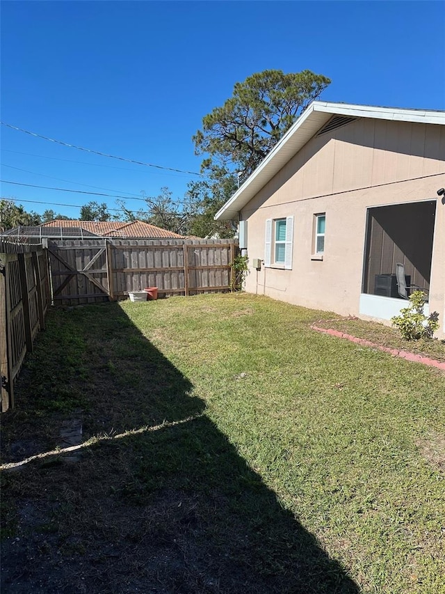 view of yard featuring a sunroom