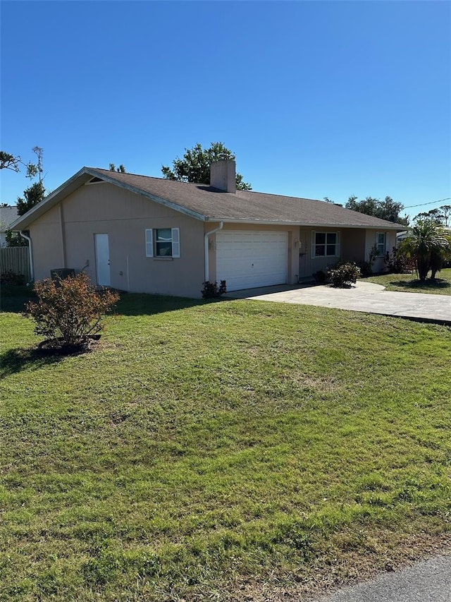 ranch-style home with a garage and a front yard