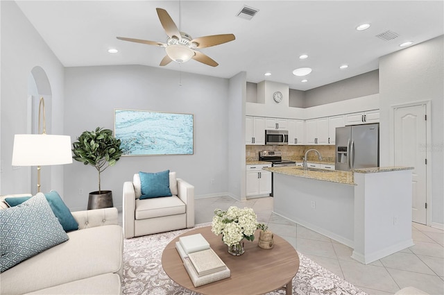 4575 Cancello Grande Ave, Venice, FL 34293 - tiled living room with lofted ceiling, sink, and ceiling fan