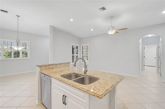 4575 Cancello Grande Ave, Venice, FL 34293 - kitchen with sink, an island with sink, white cabinets, light tile patterned flooring, and stainless steel dishwasher