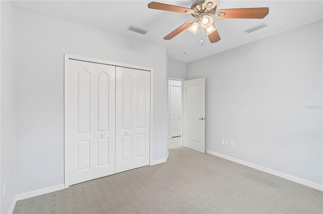 4575 Cancello Grande Ave, Venice, FL 34293 - unfurnished bedroom with light colored carpet, ceiling fan, and a closet
