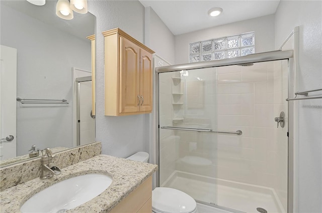 4575 Cancello Grande Ave, Venice, FL 34293 - bathroom with vanity, toilet, and a shower with shower door