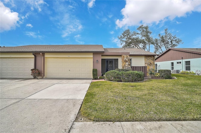 ranch-style house featuring a front lawn and a garage