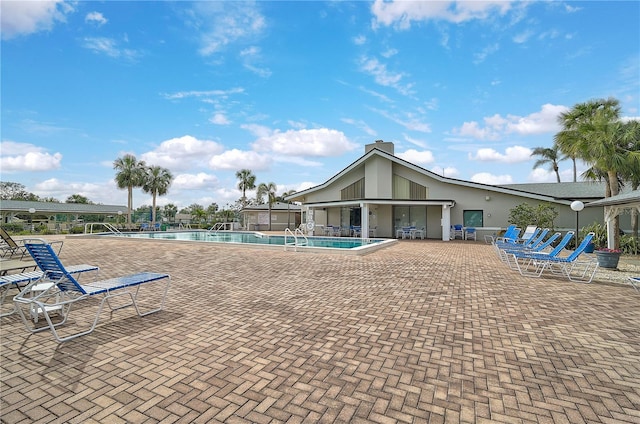 view of swimming pool featuring a patio area