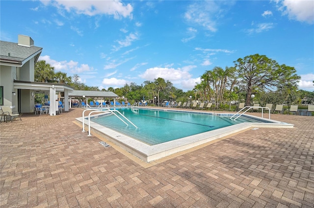 view of swimming pool with a patio