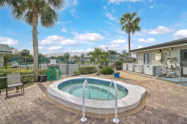 view of pool with a community hot tub