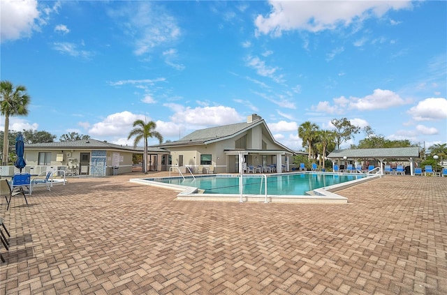 view of swimming pool with a patio