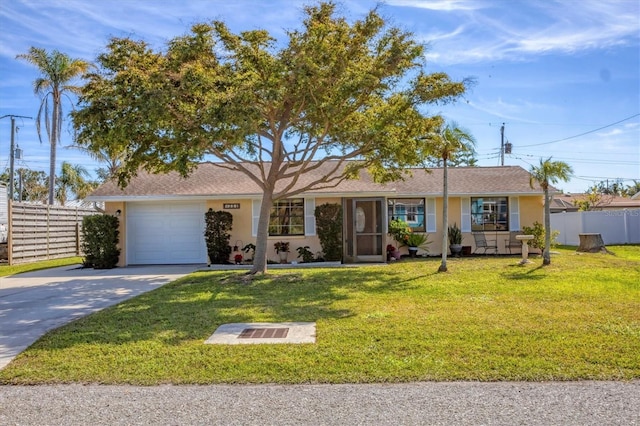 ranch-style home featuring a garage and a front lawn