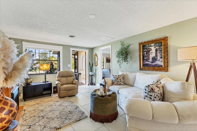 tiled living room with a textured ceiling