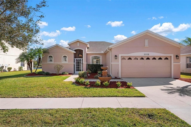 ranch-style home featuring a garage and a front lawn