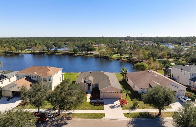 birds eye view of property with a water view