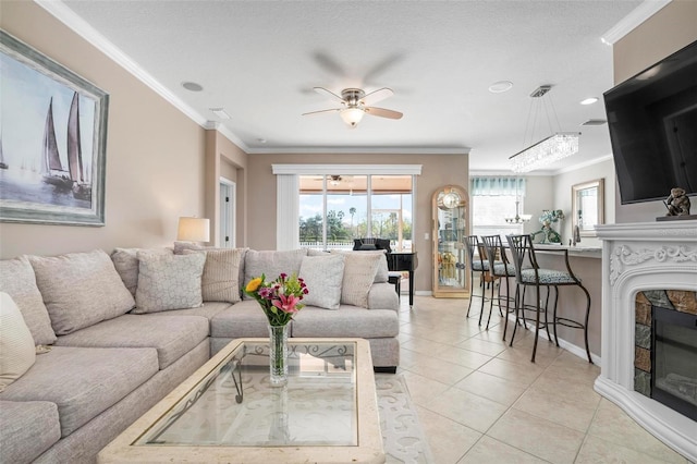 tiled living room featuring plenty of natural light, ornamental molding, and ceiling fan