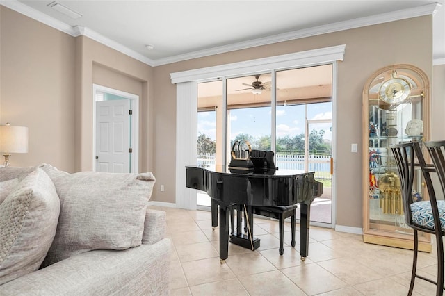 sitting room featuring light tile patterned floors, a water view, ceiling fan, and ornamental molding