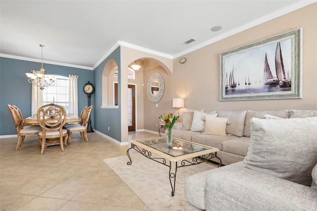 living room with a notable chandelier, ornamental molding, and light tile patterned floors