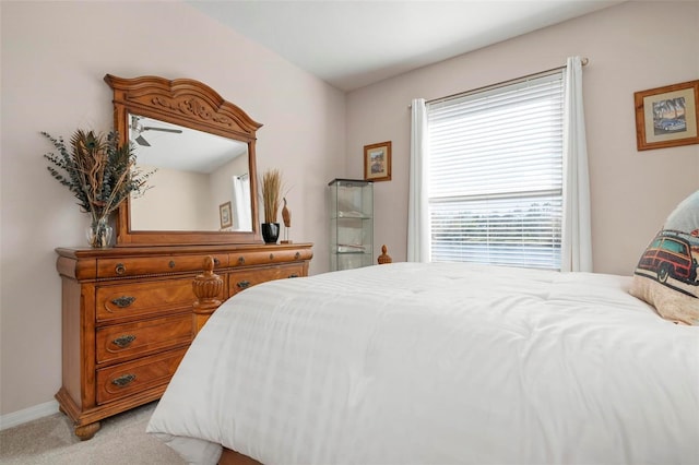 bedroom featuring light carpet