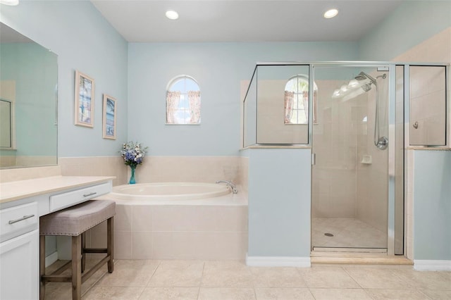 bathroom featuring tile patterned flooring, vanity, and independent shower and bath