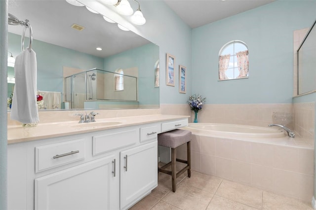 bathroom featuring tile patterned flooring, vanity, and independent shower and bath