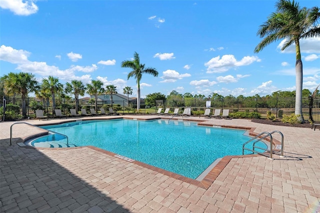 view of swimming pool featuring a patio area