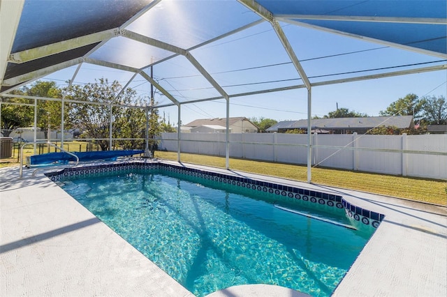 view of pool featuring a lawn, glass enclosure, a patio, and central air condition unit