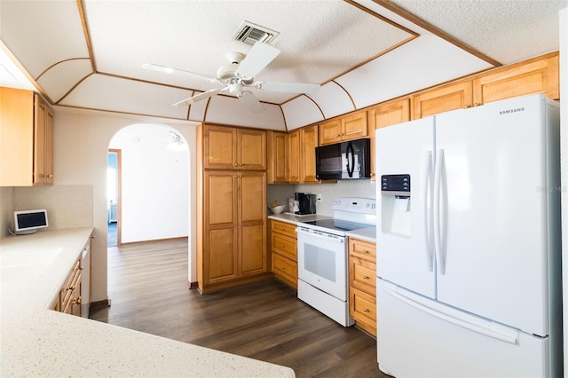 kitchen with ceiling fan, dark wood-type flooring, a textured ceiling, white appliances, and decorative backsplash