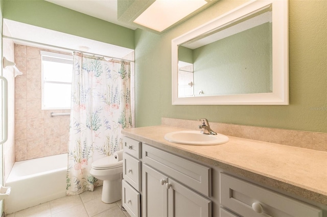 full bathroom featuring tile patterned floors, vanity, toilet, and shower / tub combo