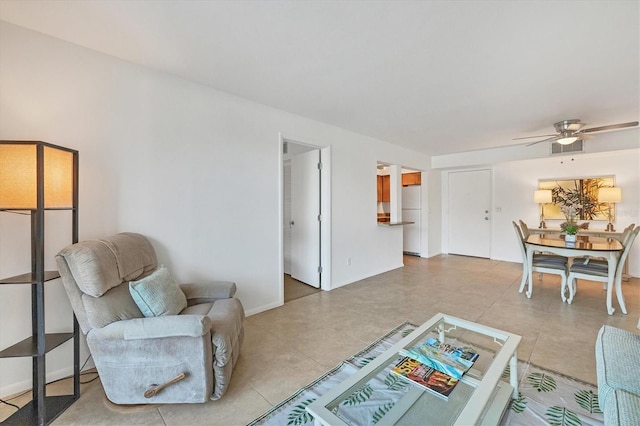 tiled living room featuring ceiling fan