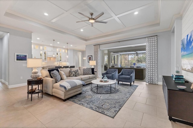 tiled living room with beamed ceiling, sink, ceiling fan, crown molding, and coffered ceiling