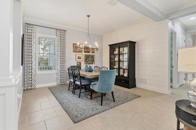 tiled dining area with beamed ceiling, ornamental molding, and a notable chandelier