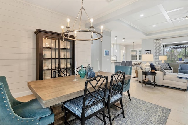 tiled dining area featuring ceiling fan with notable chandelier, crown molding, and wooden walls