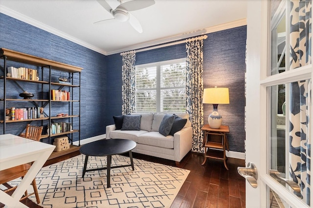 sitting room featuring ceiling fan, dark hardwood / wood-style floors, and ornamental molding