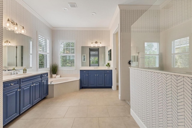 bathroom with vanity, a bathing tub, tile patterned floors, and crown molding