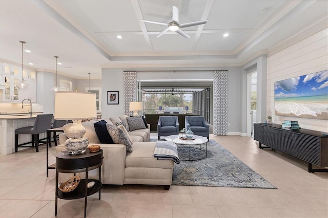 living room with ceiling fan, plenty of natural light, light tile patterned flooring, and coffered ceiling