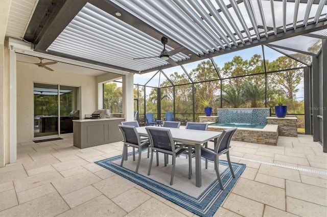 view of patio / terrace with pool water feature, exterior kitchen, and a hot tub