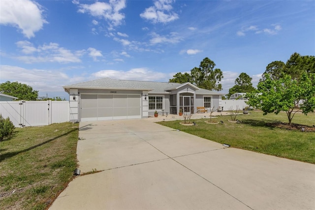 view of front facade with a front lawn and a garage