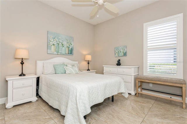 tiled bedroom with ceiling fan