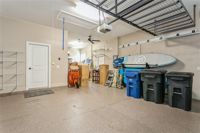 garage featuring ceiling fan and a garage door opener