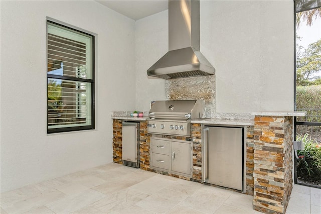 view of patio with an outdoor kitchen and area for grilling