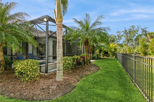 view of yard with a lanai